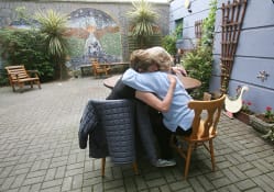 Image of two people hugging at Cork Simons emergency shelter.